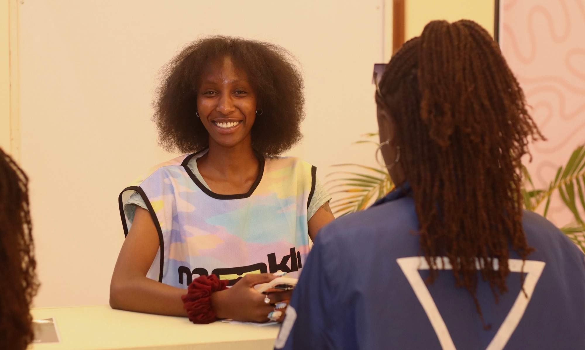 A MOOKH crew member at check-in